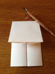 ... folding it into its own envelope ...
