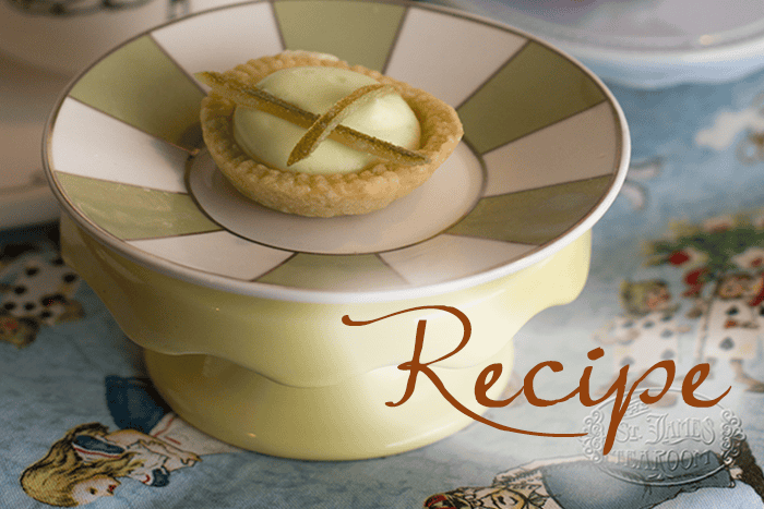 A small Lime Mousse Tart with pale green filling and candied garnish sits on a decorative plate, with the word “Recipe” written across the image.